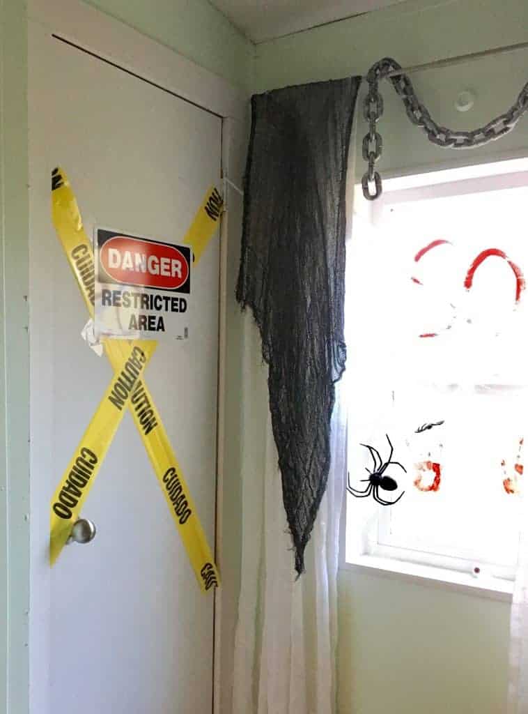 caution tape and danger signs up in a bathroom