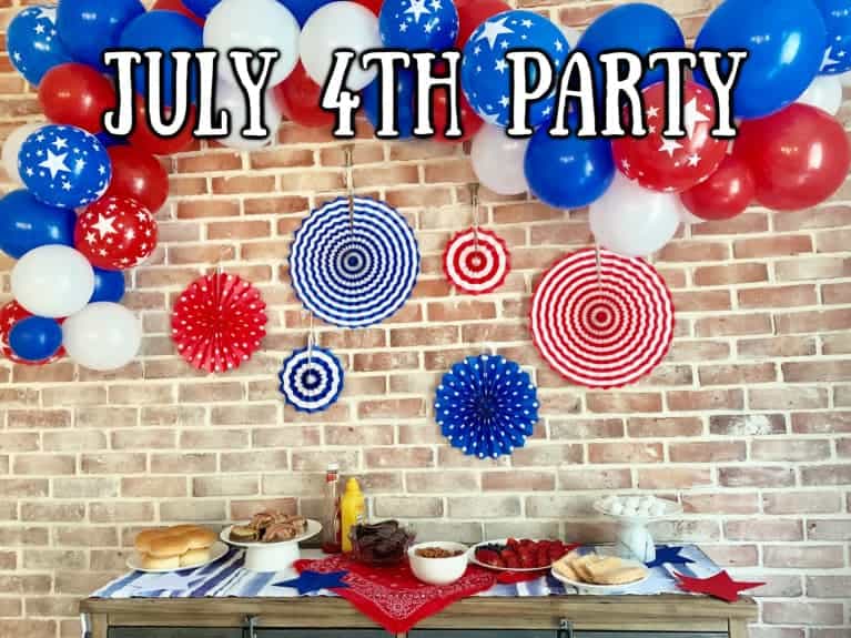 Party table set up for USA party with food and decorations