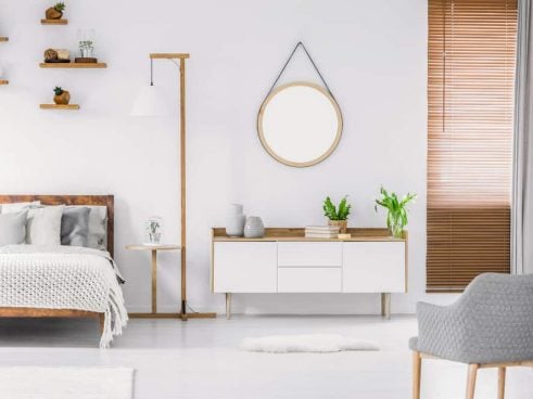 modern bedroom with ligth wood and plants