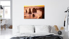 Mockup Fotokunst von Christoph Schaarschmidt: Küstenlandschaft mit imposanten Felsen und sanftem Wasser.