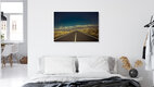 Mockup Photo art by Anke Dörschlen: road through a vast landscape under a blue sky.