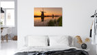 Mockup Sunrise over windmills in Holland, gentle colors and a calm atmosphere.