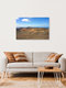 Mockup View of Timanfaya National Park with gentle volcanic landscapes and clouds in the sky.