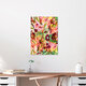 Mockup Wall art featuring a vibrant garden landscape filled with flowers and plants.