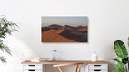 Mockup Photo art by Dennis Wehrmann: peaceful sunrise in the Sahara with gentle dunes.