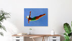 Mockup Illustration of a diver in a green swimsuit leaping into the blue sky.