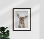 Mockup Cute baby kangaroo peeking from a pouch, set in a natural environment