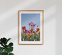 Mockup Colorful tulips against a blue sky, cheerful spring atmosphere.
