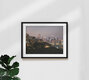 Mockup Photo art by Inflight Galerie: view of a city skyline at night with glowing lights.