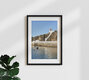 Mockup Lighthouse on the Portuguese coast: tranquil seascape with a boat and rocks in the foreground