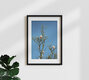 Mockup Photo art by Manuela Deigert: delicate magnolia blossoms against a blue sky