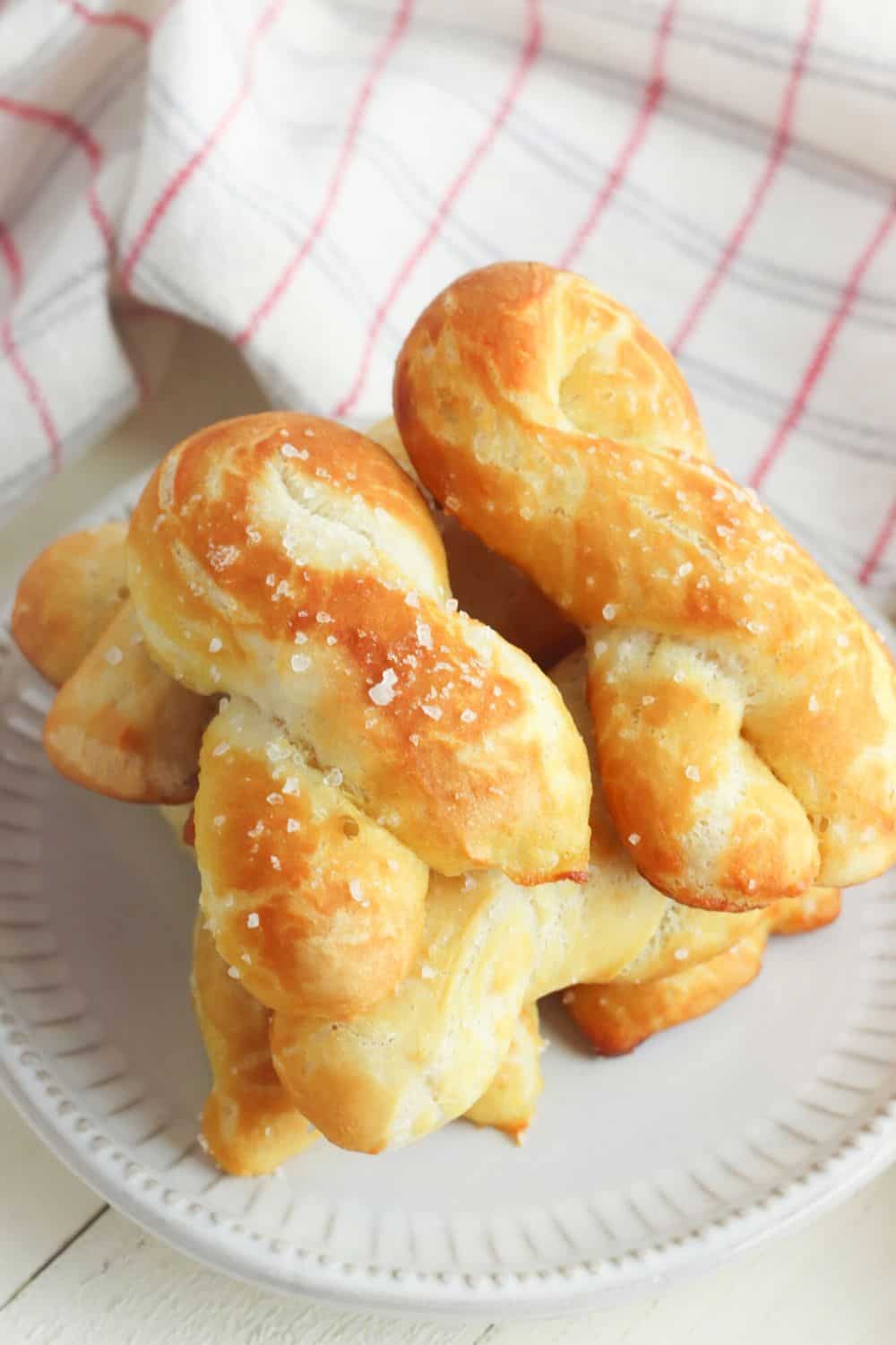 Craving a salty snack? Whip up a batch of these Easy Homemade Soft Pretzel Twists. This easy snack recipe won't last long. This basic pretzel dough recipe can be shaped into twists, knots, bites or the classic pretzel shape.