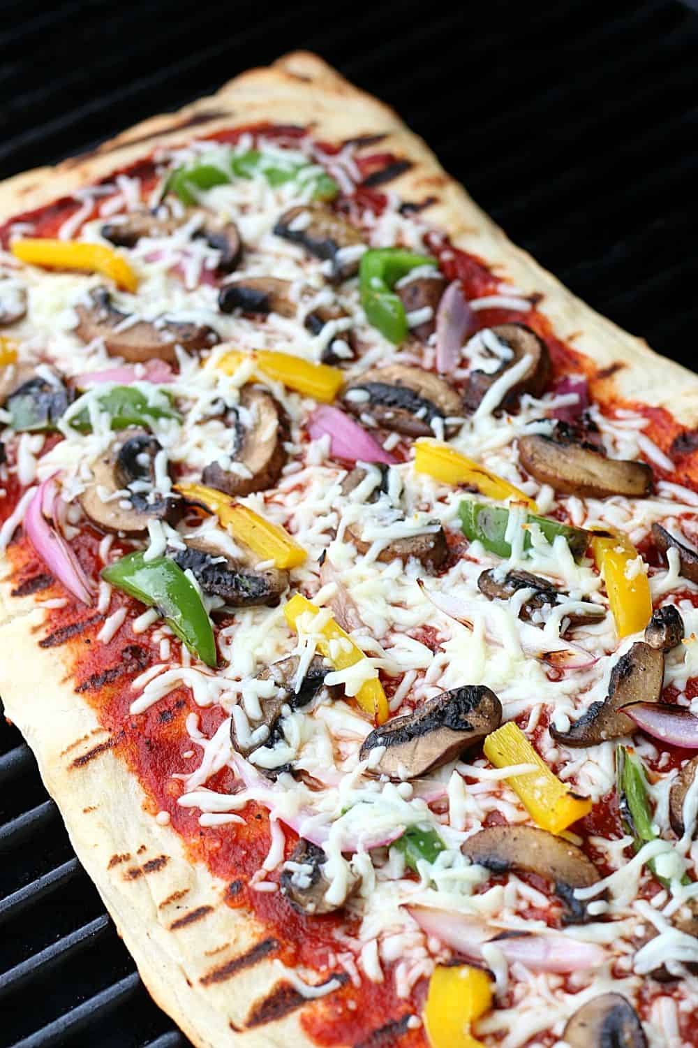It's time to fire up the grill and turn a traditional pizza recipe into an easy and delicious Grilled Pizza. Here's How To Make the Perfect Grilled Pizza recipe.
