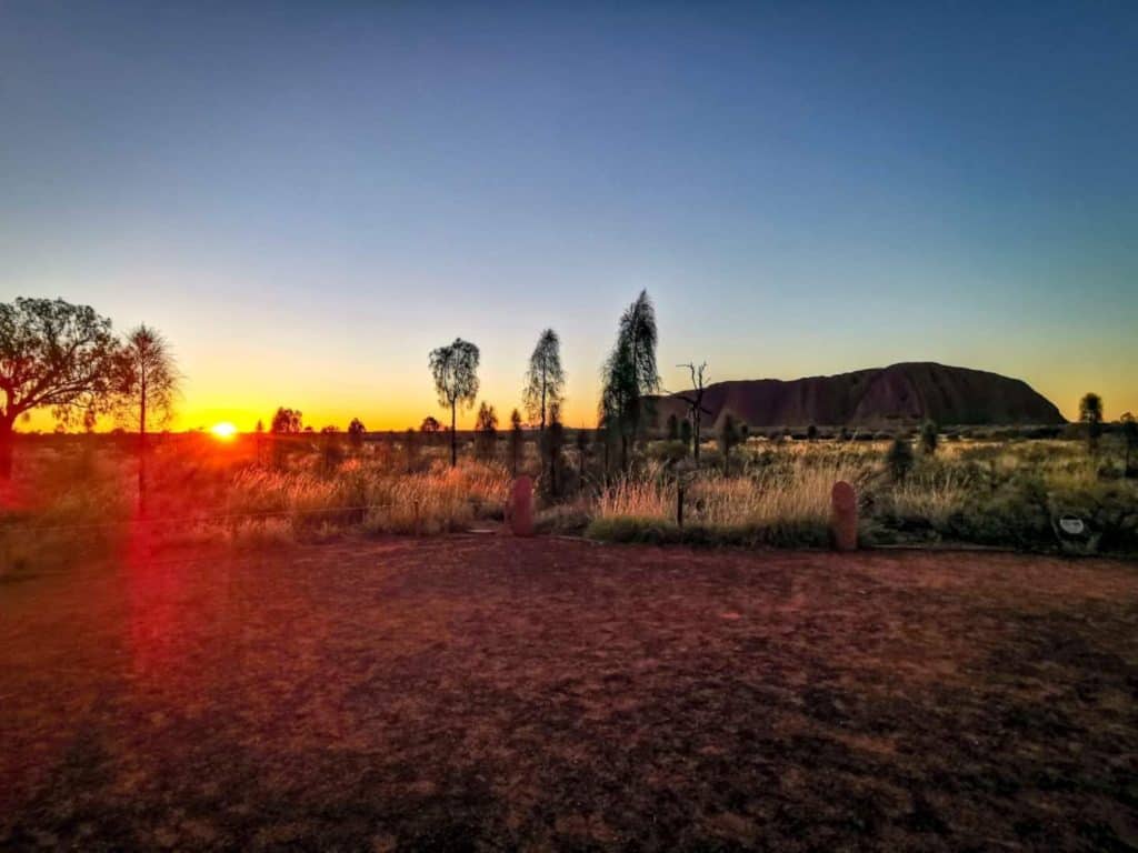 Sun setting behind Uluru/Ayers Rock
