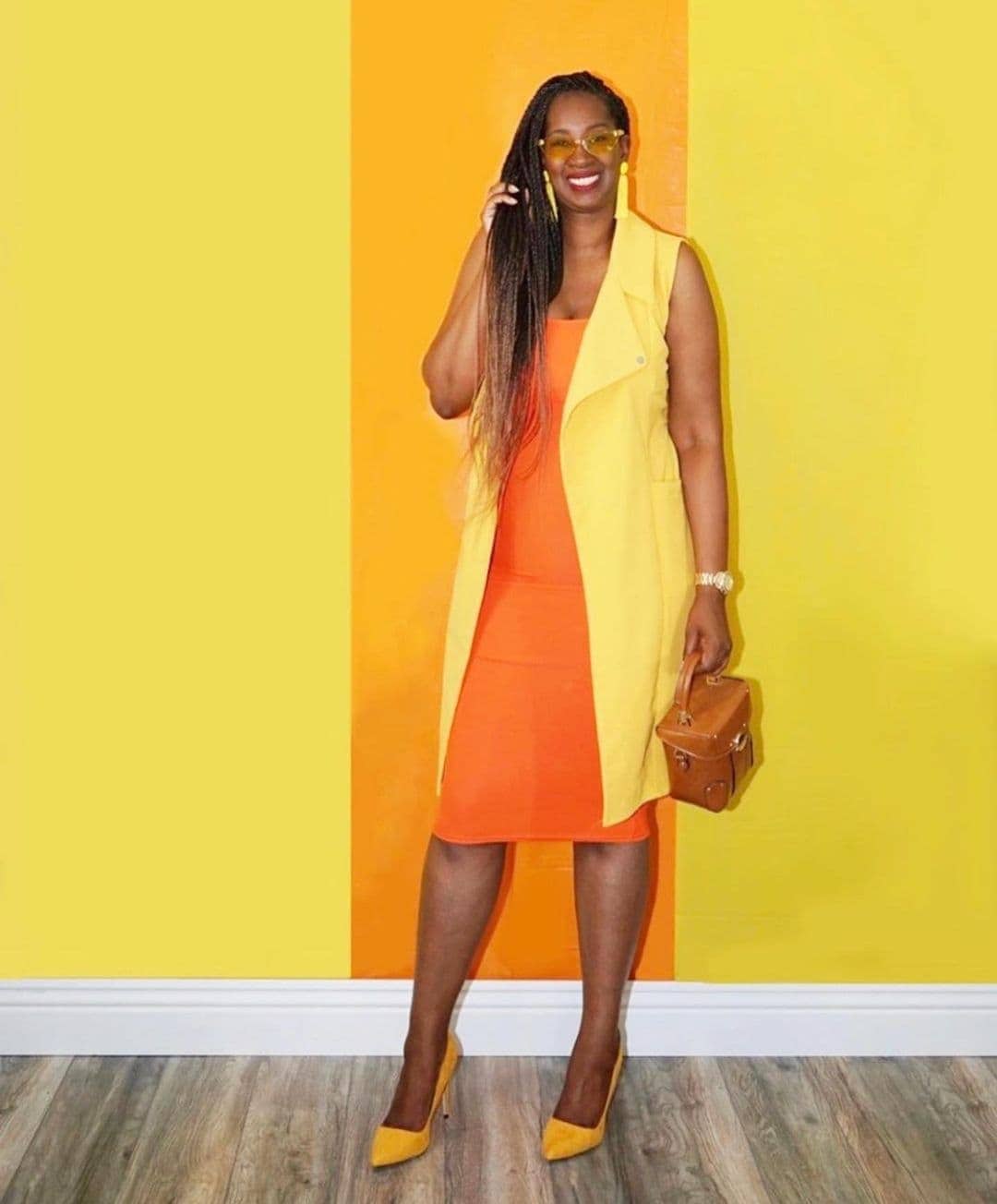 Tanasha wears a bright outfit of yellow and orange | 40plusstyle.com