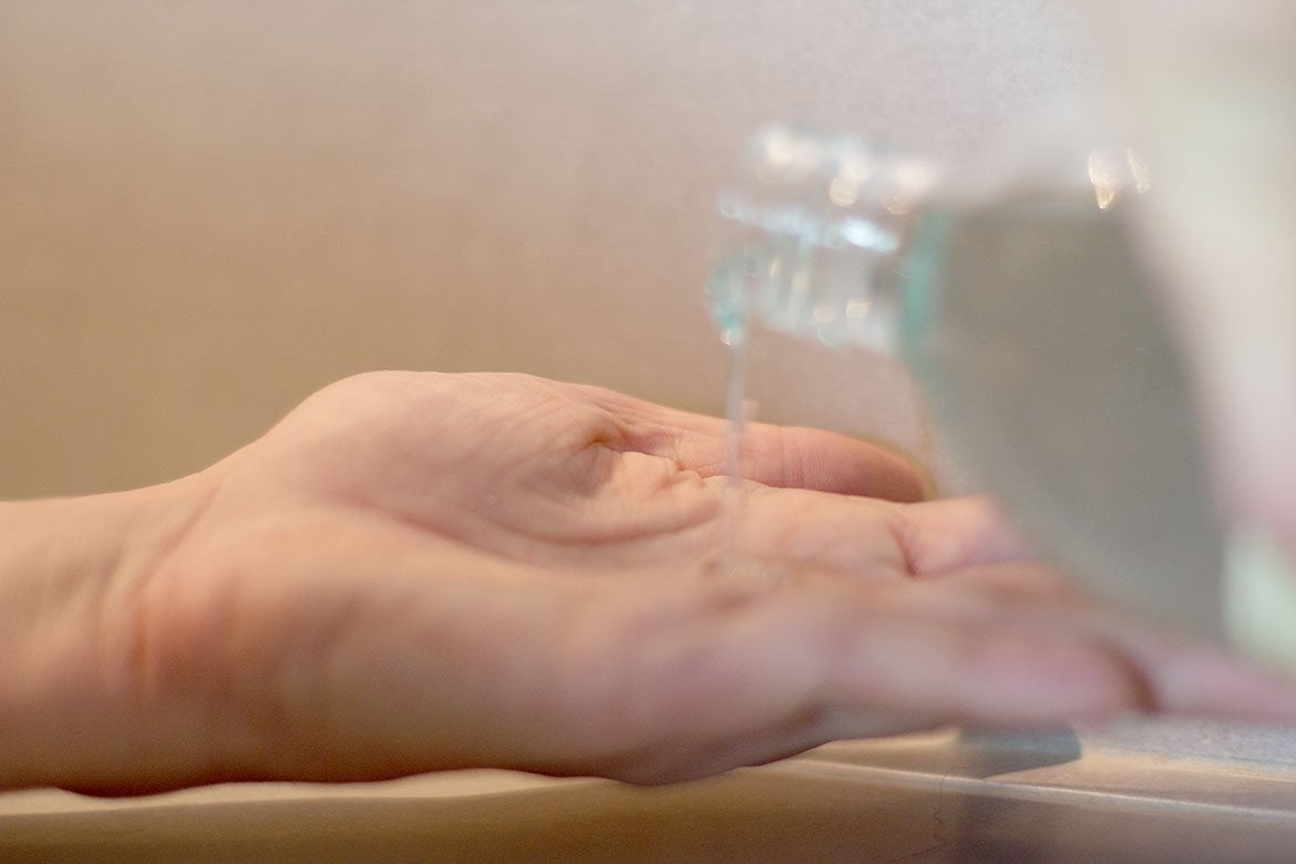 Sabon jasmine shower oil poured into one hand