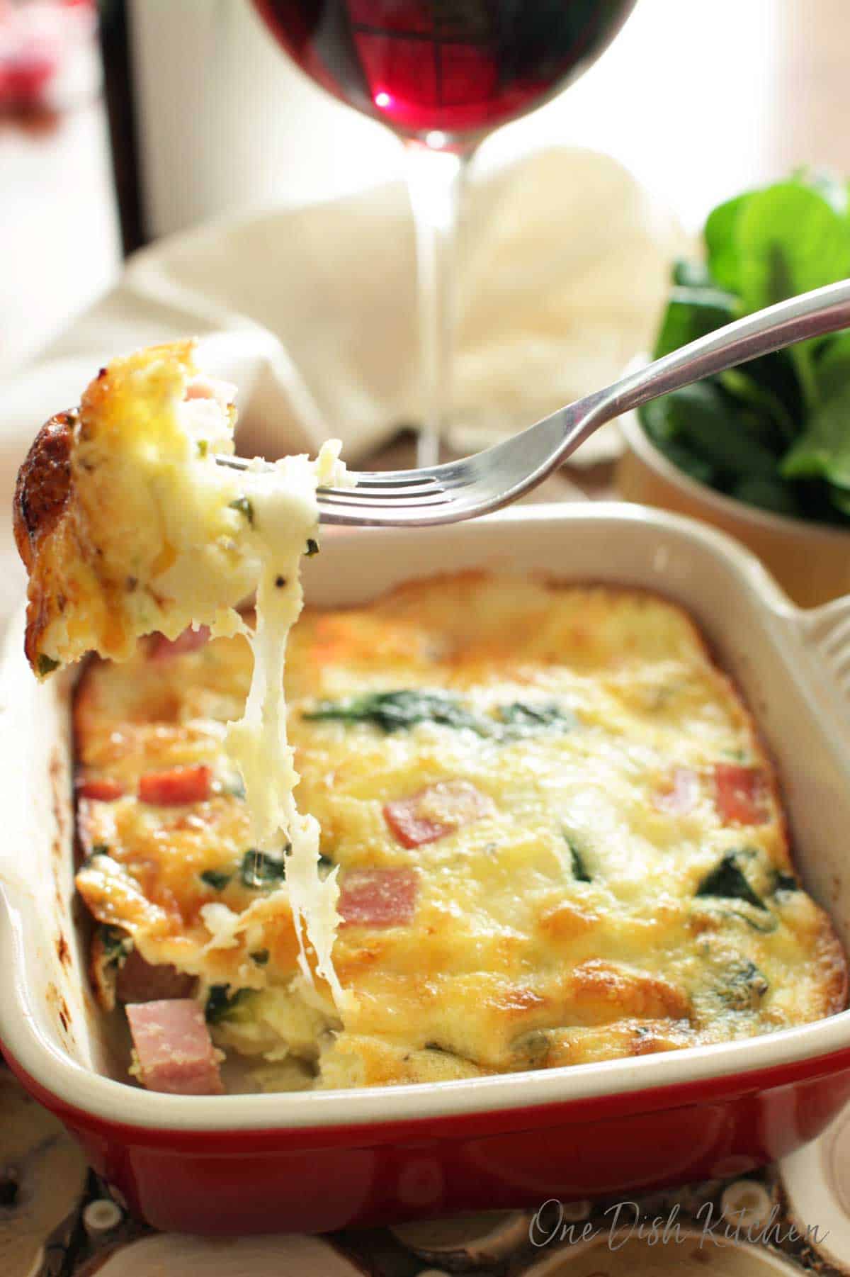 quiche with a glass of wine for one