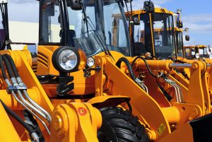 Close-up of orange farm tractors