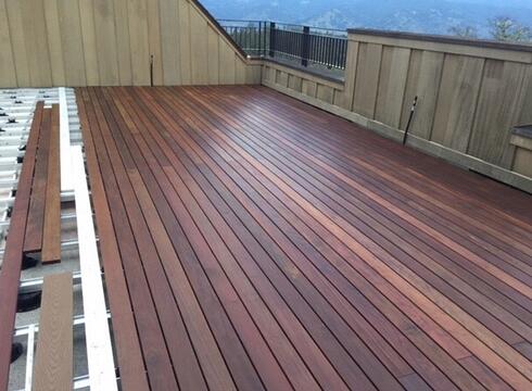 PORCH WITH A HARDWOOD ROOFTOP DECK