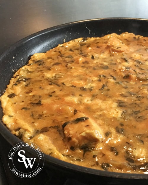left over indian takeaway curry omelette being cooked on the hob
