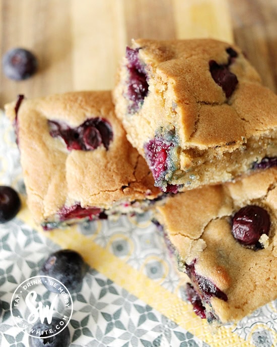 Golden giant chunky cookie studded with blueberries. Using the the easy recipe for a Blueberry Cookie Traybake
