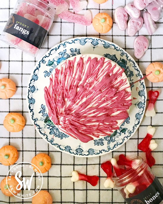 Cheesecake drizzled with white chocolate dyed red for Halloween