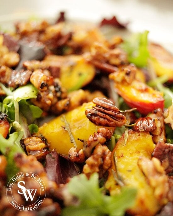 Maple syrup glazed walnuts and pecans on top of the grilled peach salad.