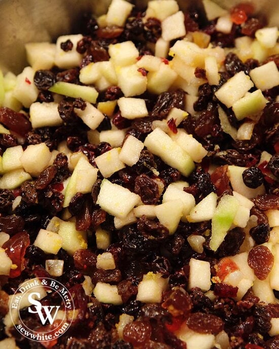 English Christmas pudding ingredients of dried fruits, fresh apple and peel