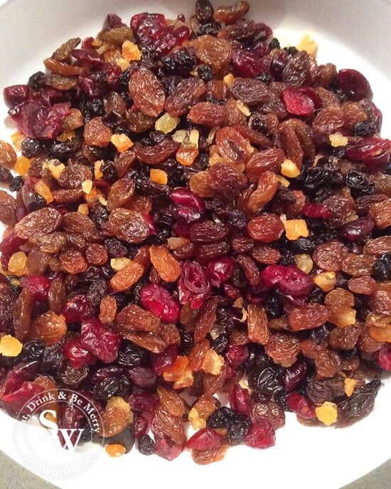 mixed dried fruit in a large mixing bowl