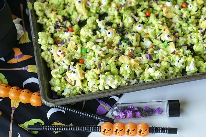 Double, double toil and trouble, Fire burn, and cauldron bubble. Stir up a batch of this ghoulish Cauldron Corn for some Halloween fun. #Halloween #Halloweenparty #HalloweenCandy #Snacks #Popcorn