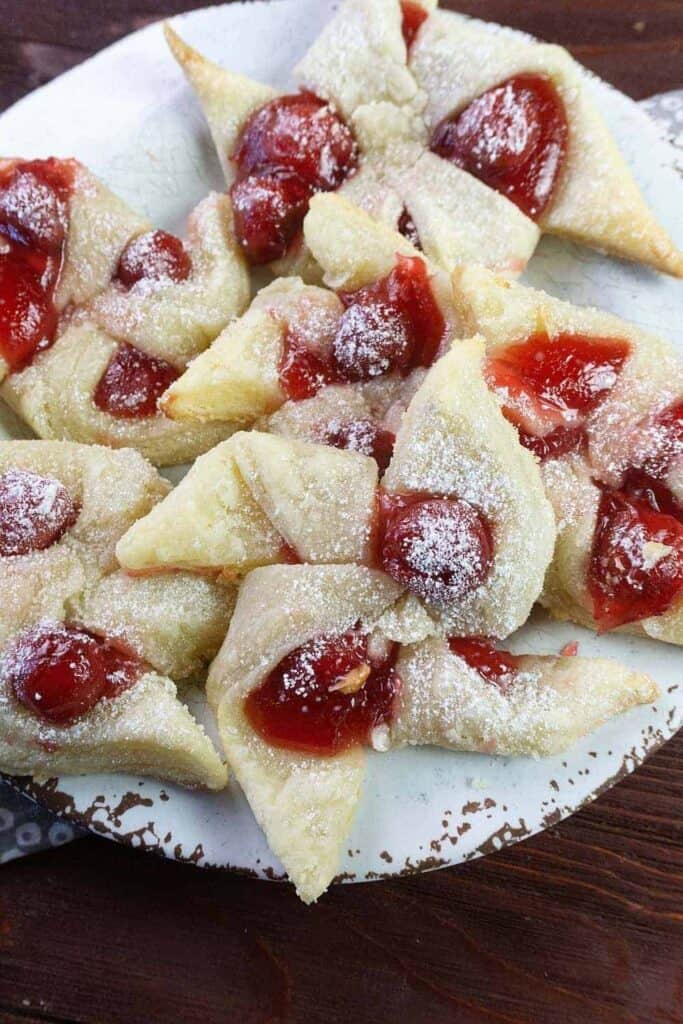 These flaky Cherry Cream Cheese Pinwheel Cookies are a twist on the traditional Hungarian Kolaches Christmas Cookie recipe.