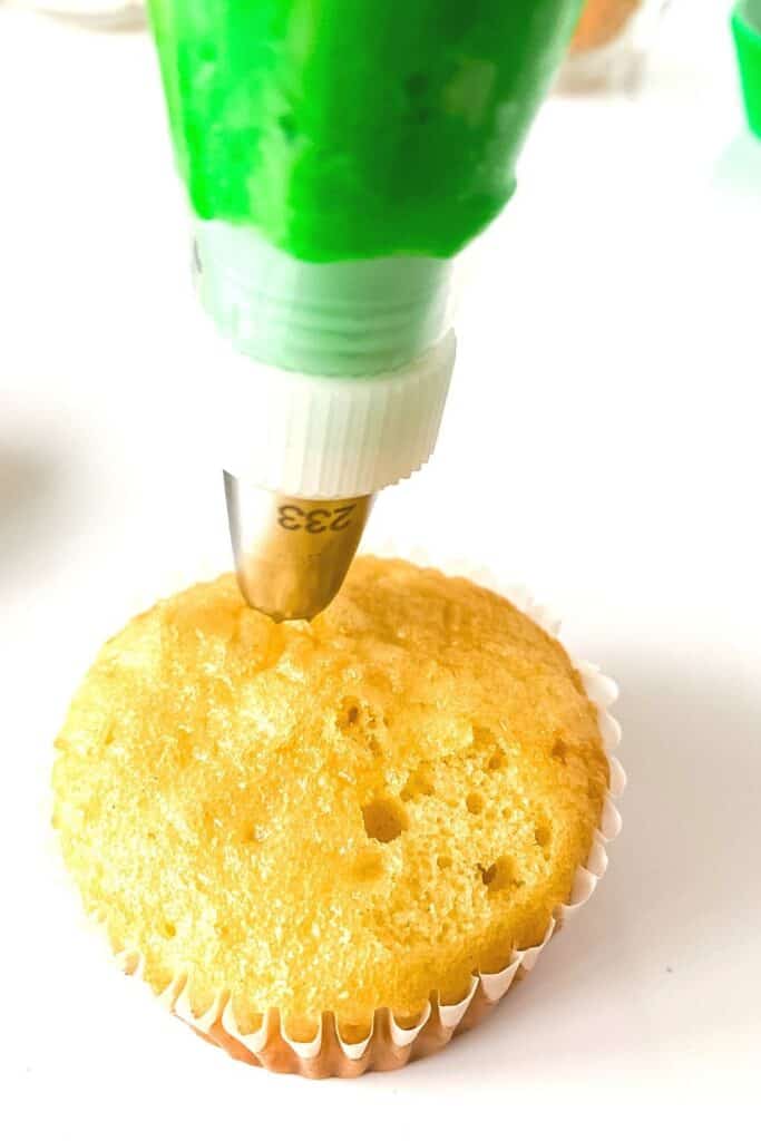 Hippity Hoppity, these Easy Bunny Butt Cupcakes are the perfect Easter dessert. This cute Easter Cupcake recipe is easy to decorate and fun to eat. This homemade cupcake recipe is perfect for Easter. Make these adorable Easter cupcakes that use a doughnut hole as the bunny's bottom. The kids will have a blast helping with these Easter Cupcakes!
