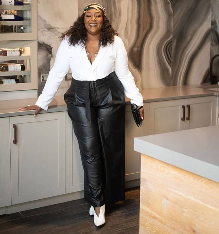 Nikki in a pair of leather pants and white top | 40plusstyle.com