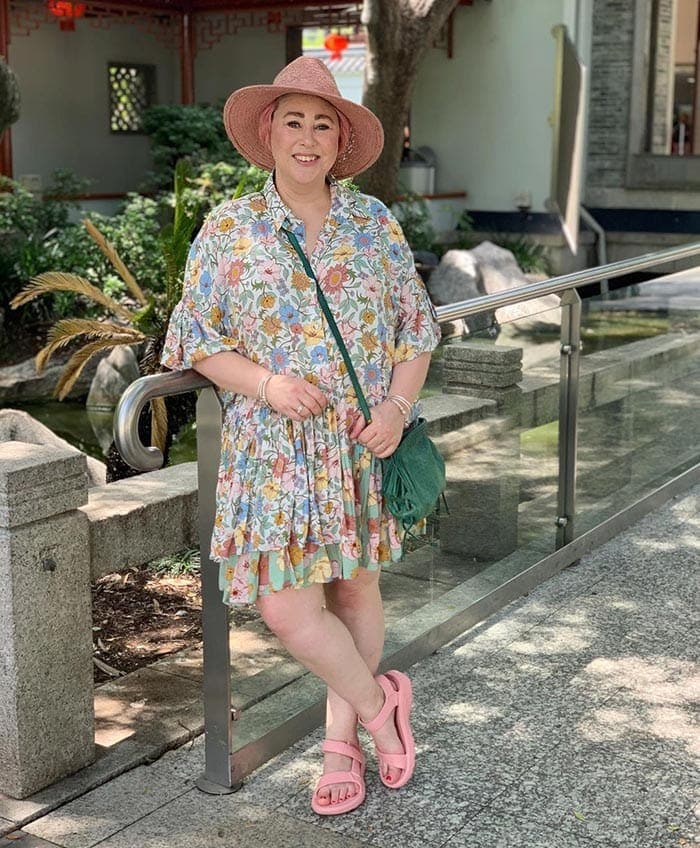 Kim in a printed floral dress, sandals and hat | 40plusstyle.com