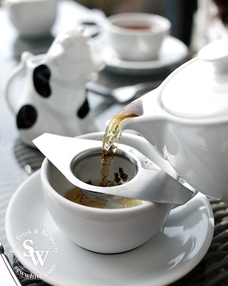 Elegant Tea straining bird and blend tea at afternoon tea