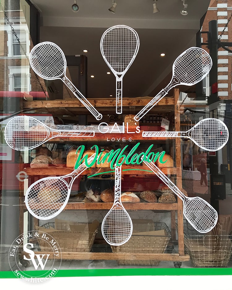 The hand drawn wimbledon inspired motif on Gail's bakery window in wimbleon village.