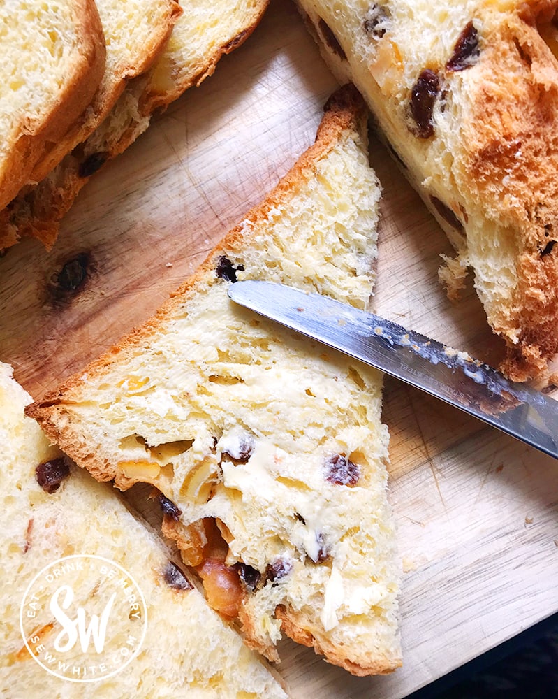 Buttering the panettone for the Panettone Bread and Butter Pudding