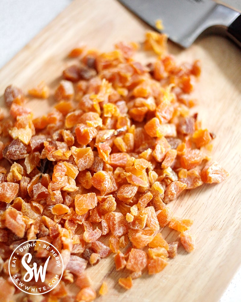 chopped apricots on a wooden board