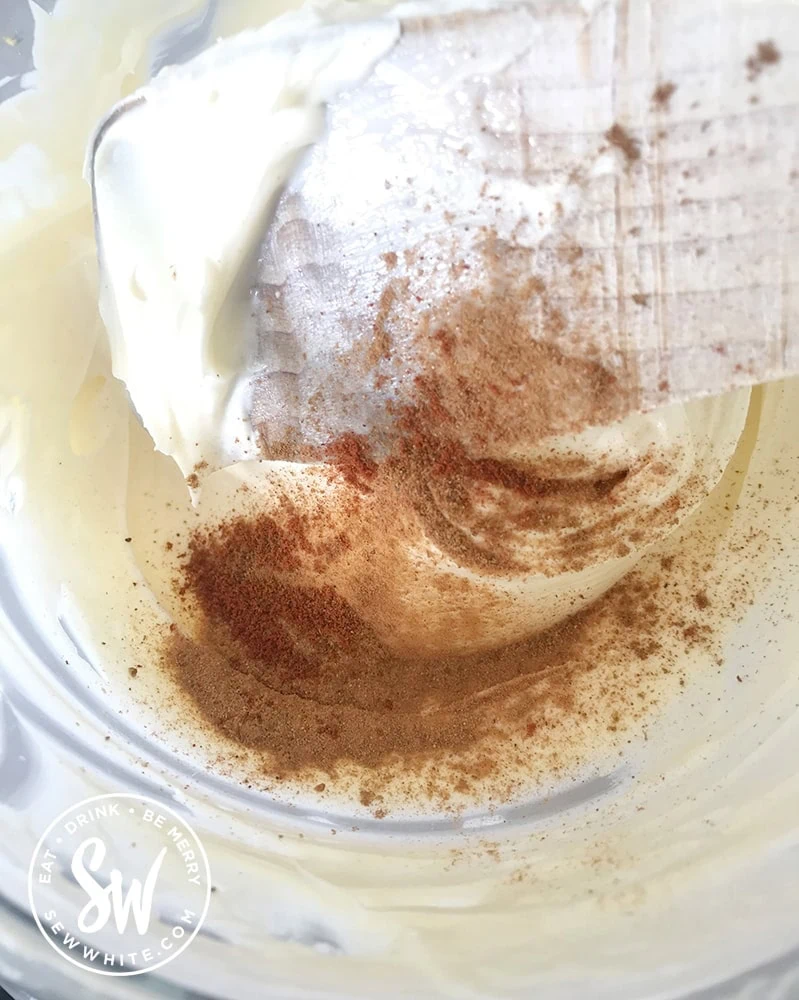 Adding pumpkin spice to a cheesecake batter for a pumpkin spice cheesecake