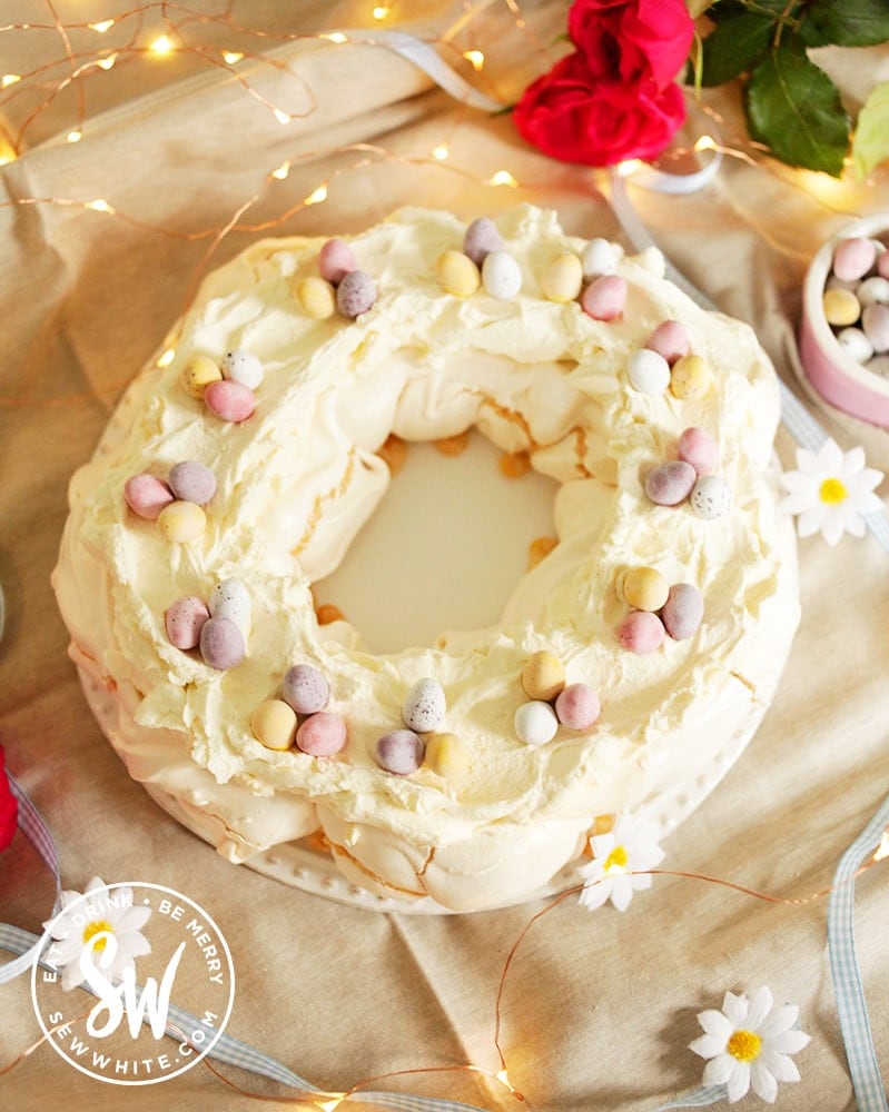 Pavlova base with cream topping ready to be decorated for the Easter meringue