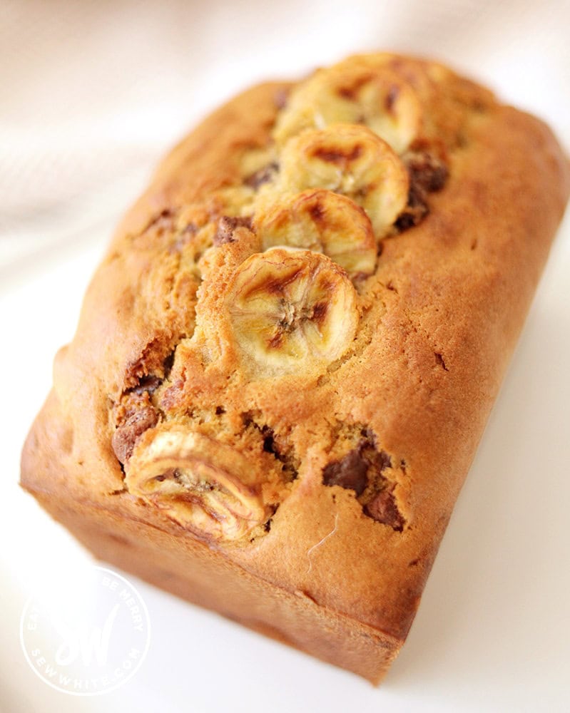 Banana Bread with Chocolate Chips with dessert fork and milk