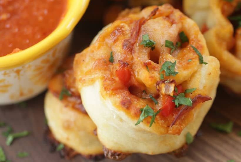 When you want to change up your normal pizza routine, try this easy Pepperoni Pizza Pinwheels recipe instead. They are a perfect snack or meal option. #Ad #LivenUpYourMeal #Mezzetta #MezzettaSauce #KetoLife #PizzaRecipe #Pinwheels