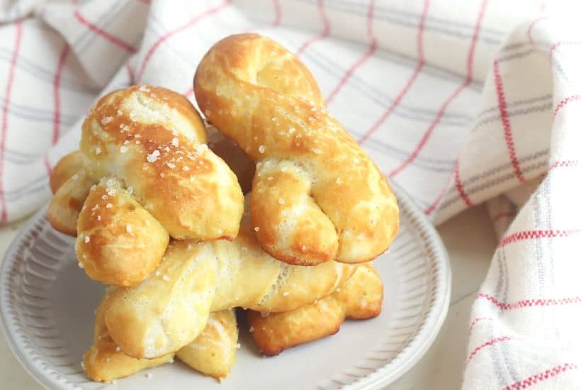 Craving a salty snack? Whip up a batch of these Easy Homemade Soft Pretzel Twists. This easy snack recipe won't last long. This basic pretzel dough recipe can be shaped into twists, knots, bites or the classic pretzel shape.