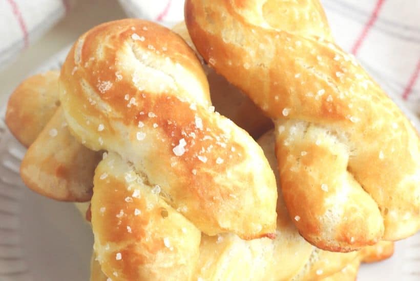 Craving a salty snack? Whip up a batch of these Easy Homemade Soft Pretzel Twists. This easy snack recipe won't last long. This basic pretzel dough recipe can be shaped into twists, knots, bites or the classic pretzel shape.