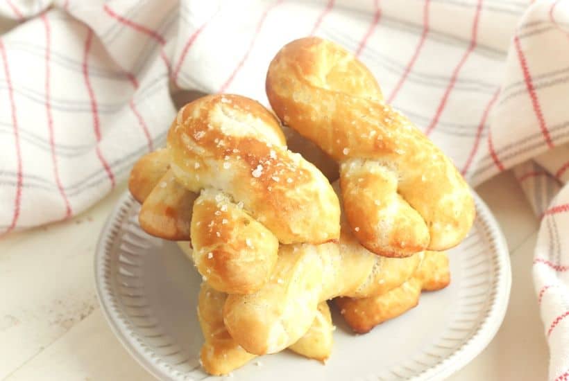 Craving a salty snack? Whip up a batch of these Easy Homemade Soft Pretzel Twists. This easy snack recipe won't last long. This basic pretzel dough recipe can be shaped into twists, knots, bites or the classic pretzel shape.