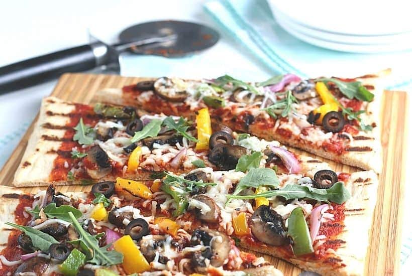 It's time to fire up the grill and turn a traditional pizza recipe into an easy and delicious Grilled Pizza. Here's How To Make the Perfect Grilled Pizza recipe.
