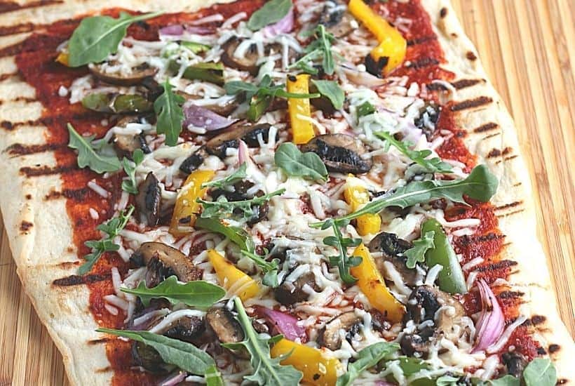 It's time to fire up the grill and turn a traditional pizza recipe into an easy and delicious Grilled Pizza. Here's How To Make the Perfect Grilled Pizza recipe.