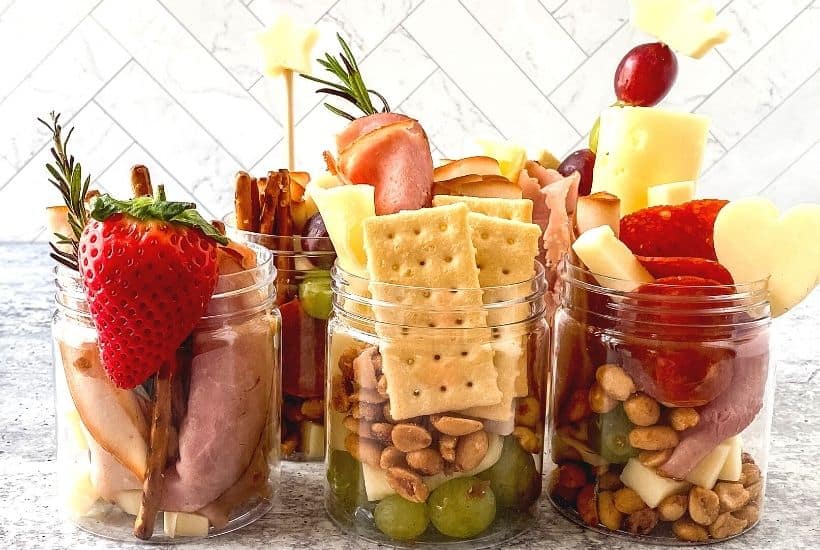 Jarcuterie Mason Jars are a fun alternative to a charcuterie board. These mason jar appetizers are individually portioned Charcuterie mason jars. They are an easy party idea to serve at your next gathering.