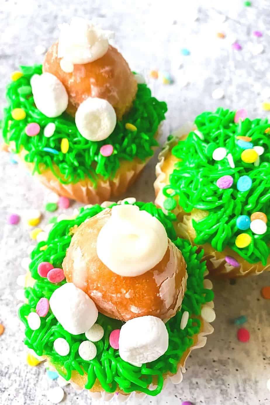 Hippity Hoppity, these Easy Bunny Butt Cupcakes are the perfect Easter dessert. This cute Easter Cupcake recipe is easy to decorate and fun to eat. This homemade cupcake recipe is perfect for Easter. Make these adorable Easter cupcakes that use a doughnut hole as the bunny's bottom. The kids will have a blast helping with these Easter Cupcakes!