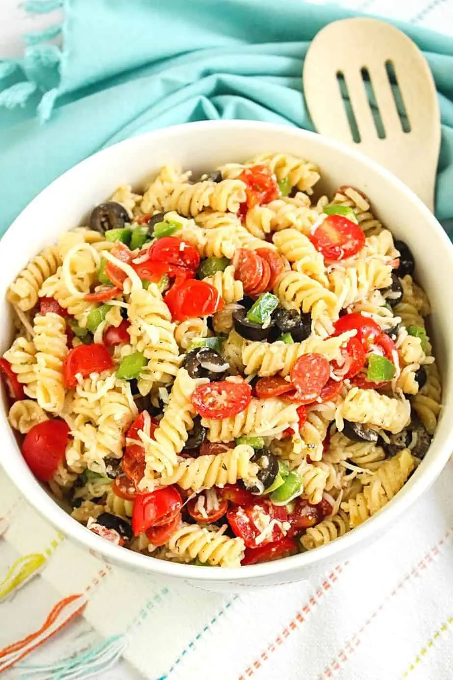 Easy Pepperoni Pasta Salad is a cold pasta salad recipe filled with pepperoni, cheese, vegetables and homemade Italian dressing. This zesty pepperoni pasta salad is perfect for potlucks, summer BBQs and large crowds!